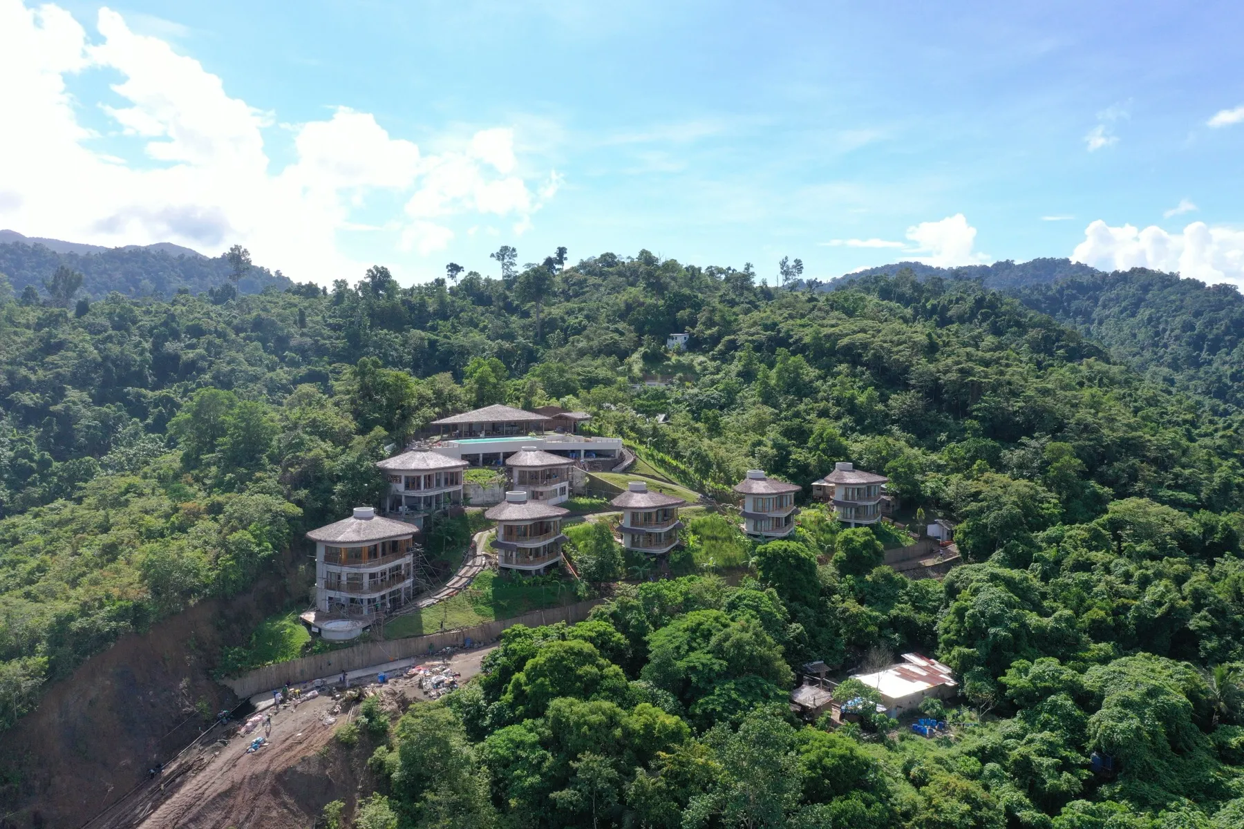 Aerial view of Atalaya Resort on the forested hillside above El Nido, Palawan