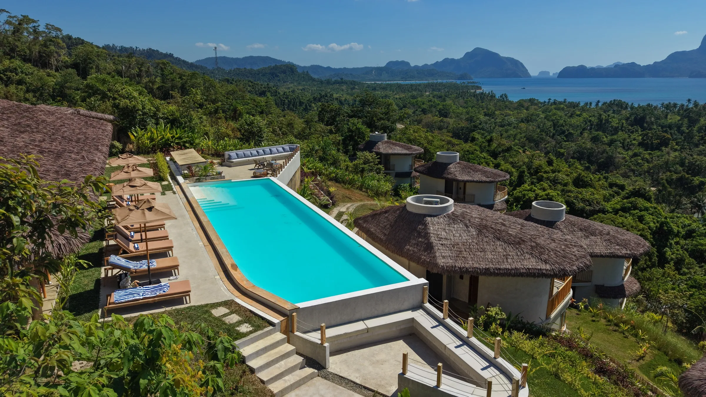 Aerial view of Atalaya Resort's infinity pool and villas above Bacuit Bay