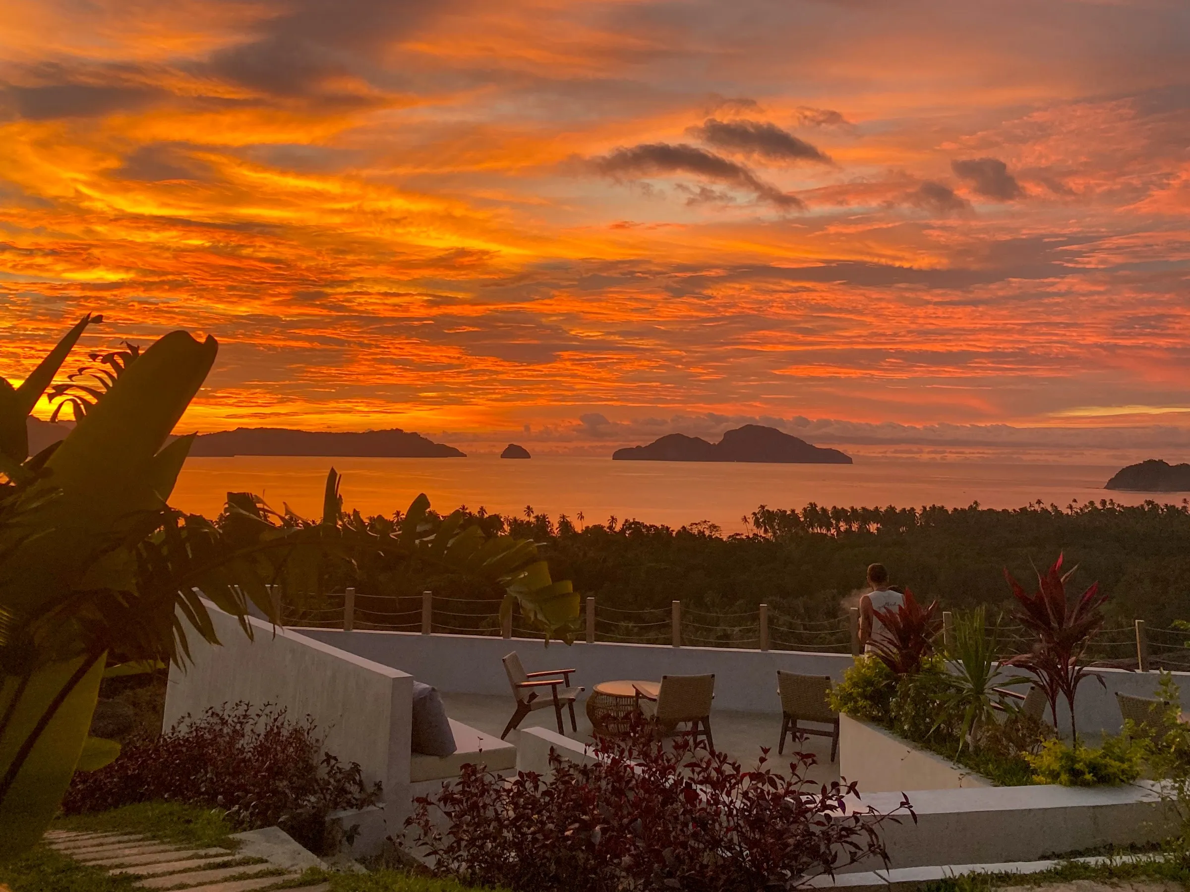 Sunset over Bacuit Bay from the terrace at Atalaya Resort